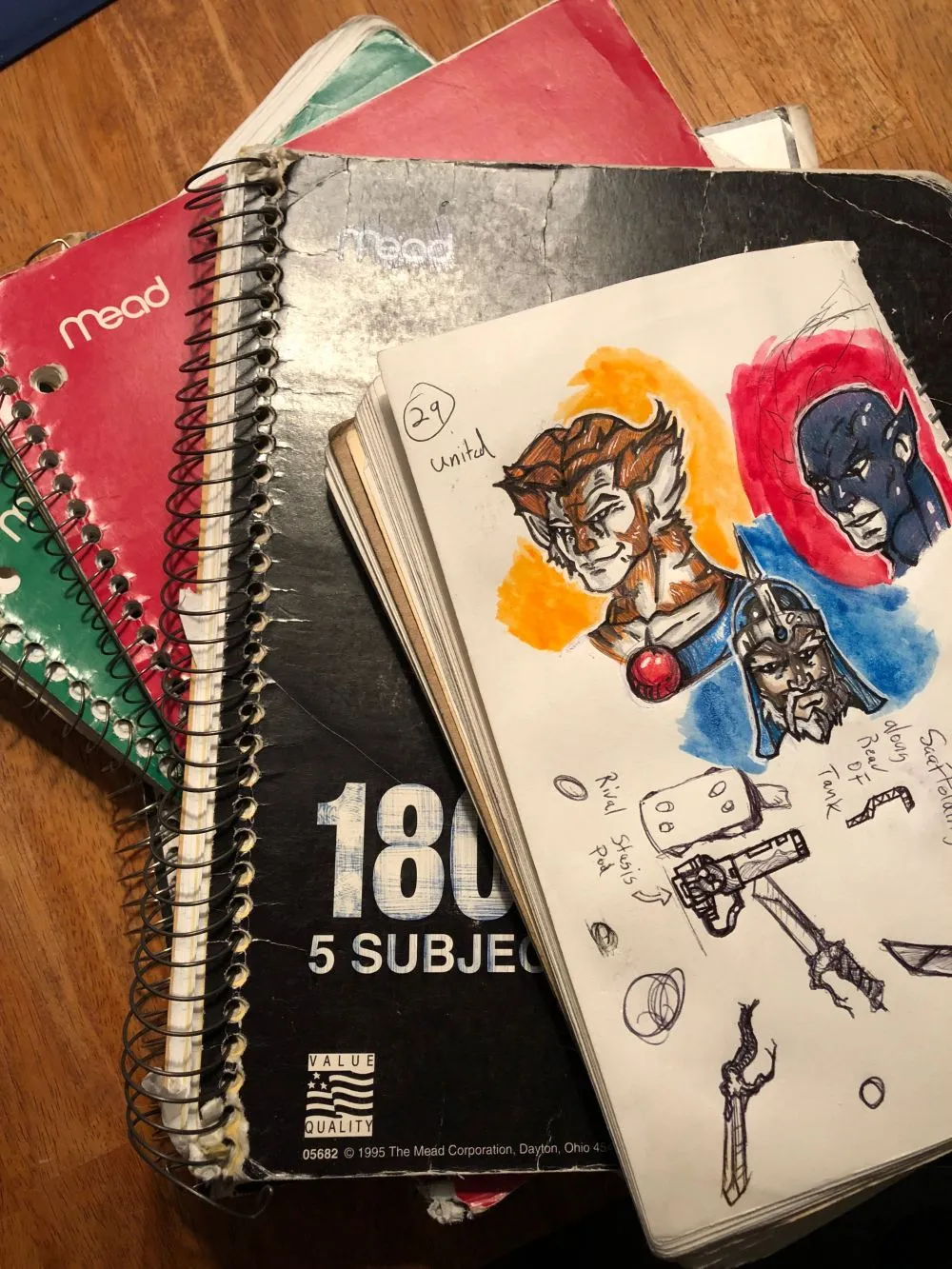 notebooks on the floor with art